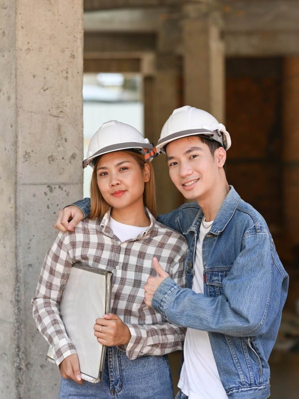 two-happy-investors-in-helmet-standing-at-construction-site-real-estate-investors-concept-1-1.jpg